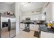 Well-equipped kitchen showcasing stainless steel appliances and white cabinetry at 11117 Bloomington Dr, Tampa, FL 33635