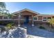 Front entrance with blue door and paver walkway at 15 Marina Ter, Treasure Island, FL 33706