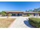 Back exterior of home, showcasing patio and pool area at 15 Marina Ter, Treasure Island, FL 33706