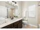 Clean bathroom with dark brown vanity and a shower/tub combo at 15435 27Th E Ct, Parrish, FL 34219
