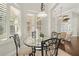 Charming breakfast nook with glass-top table and wrought-iron chairs at 15435 27Th E Ct, Parrish, FL 34219