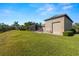 Detached garage with large door and extra space at 15435 27Th E Ct, Parrish, FL 34219
