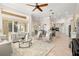 Bright and airy living room with comfortable seating and access to patio at 15435 27Th E Ct, Parrish, FL 34219