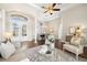 Spacious living area with hardwood floors, high ceilings, and a view to the formal dining room at 15435 27Th E Ct, Parrish, FL 34219