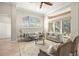 Spacious living area with large windows, plush sofas, and a relaxing atmosphere at 15435 27Th E Ct, Parrish, FL 34219