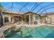 Inviting pool and patio area with covered lanai at 15435 27Th E Ct, Parrish, FL 34219