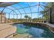 Relaxing pool area with screened enclosure and water features at 15435 27Th E Ct, Parrish, FL 34219