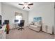 Spacious home office with a desk, comfortable seating, and ample storage at 21489 Billowy Jaunt Dr, Land O Lakes, FL 34637