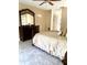 Spacious bedroom with a king-size bed and dresser at 2415 Sutton Pl, Spring Hill, FL 34608