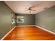 Spacious bedroom with hardwood floors, ceiling fan and green walls at 2621 13Th N St, St Petersburg, FL 33704