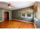 Bedroom with hardwood floors, ceiling fan, and built-in closet at 2621 13Th N St, St Petersburg, FL 33704