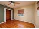 Hardwood floor bedroom with wood closet and ceiling fan at 2621 13Th N St, St Petersburg, FL 33704