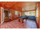 Inviting game room features a pool table and wood-paneled walls at 2621 13Th N St, St Petersburg, FL 33704