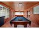 Game room with pool table, wood walls, and tiled floor at 2621 13Th N St, St Petersburg, FL 33704