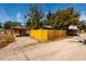 Yellow wood fence and house exterior at 2621 13Th N St, St Petersburg, FL 33704