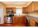 Kitchen boasts stainless steel appliances and wood cabinets at 2621 13Th N St, St Petersburg, FL 33704