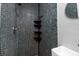 Shower stall with hexagon tile and corner shelves at 2621 13Th N St, St Petersburg, FL 33704