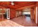 Sunroom with wood-paneled walls and pool table at 2621 13Th N St, St Petersburg, FL 33704