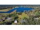 Aerial view showing home, lake, and surrounding landscape at 3111 Lewis Rd, Dover, FL 33527