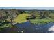 Lakefront property with lush landscaping and tranquil waters at 3111 Lewis Rd, Dover, FL 33527