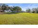 Large grassy backyard with mature trees at 3111 Lewis Rd, Dover, FL 33527