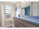 Bathroom with light blue vanity, shower, and tiled floor at 3111 Lewis Rd, Dover, FL 33527