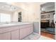 Main bathroom with double sinks and access to bedroom at 3111 Lewis Rd, Dover, FL 33527