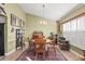 Classic dining room features a round table and wooden chairs at 3111 Lewis Rd, Dover, FL 33527