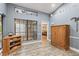 Spacious hallway with built-in wooden cabinet and access to bedrooms at 3111 Lewis Rd, Dover, FL 33527