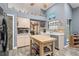 Kitchen boasts a butcher block island and stainless steel appliances at 3111 Lewis Rd, Dover, FL 33527