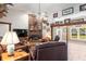 Living room features a fireplace and views to the backyard at 3111 Lewis Rd, Dover, FL 33527