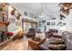 Spacious living room with leather sofas and brick fireplace at 3111 Lewis Rd, Dover, FL 33527
