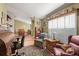 Home office with built-in desk and comfortable seating at 3111 Lewis Rd, Dover, FL 33527