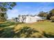 Detached workshop and carport on a grassy lot at 3111 Lewis Rd, Dover, FL 33527