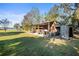 Rustic wooden storage shed with open sides, great for equipment at 3111 Lewis Rd, Dover, FL 33527