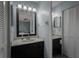 Clean bathroom with vanity, mirror, and linen closet at 3159 138Th Pl, Largo, FL 33771