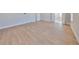 A large bedroom with luxury vinyl plank flooring has several entryways at 3509 W Leona St, Tampa, FL 33629