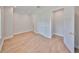 Bright bedroom with hardwood floors, neutral walls, and walk-in closet at 3509 W Leona St, Tampa, FL 33629