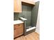 Convenient dog wash station with green tile and built-in cabinets at 3509 W Leona St, Tampa, FL 33629