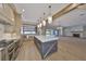 Spacious kitchen and living room boast an open layout with contemporary design at 3509 W Leona St, Tampa, FL 33629