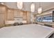 Modern kitchen features a large island, stainless appliances, and a farmhouse sink at 3509 W Leona St, Tampa, FL 33629