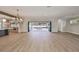 Open concept kitchen with island and sliding doors to the outdoor space at 3509 W Leona St, Tampa, FL 33629