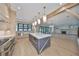 Bright kitchen with island, stainless appliances, and open floor plan at 3509 W Leona St, Tampa, FL 33629