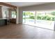 Bright living room with folding glass doors opening to the pool and patio at 3509 W Leona St, Tampa, FL 33629