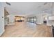 Spacious living room with hardwood floors, modern fireplace, and backyard access at 3509 W Leona St, Tampa, FL 33629