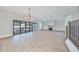 Bright living room with hardwood floors, modern fireplace, and access to backyard at 3509 W Leona St, Tampa, FL 33629
