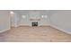 Relaxing living room with fireplace, hardwood floors, and natural lighting at 3509 W Leona St, Tampa, FL 33629