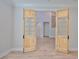 Home office featuring beautiful wood floors and unique wood frame glass doors at 3509 W Leona St, Tampa, FL 33629