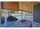 Modern outdoor kitchen with stainless steel appliances overlooking the screened-in pool and patio area at 3509 W Leona St, Tampa, FL 33629