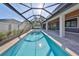 Beautiful backyard pool and spa enclosed by a screened-in lanai with ample space for outdoor living at 3509 W Leona St, Tampa, FL 33629